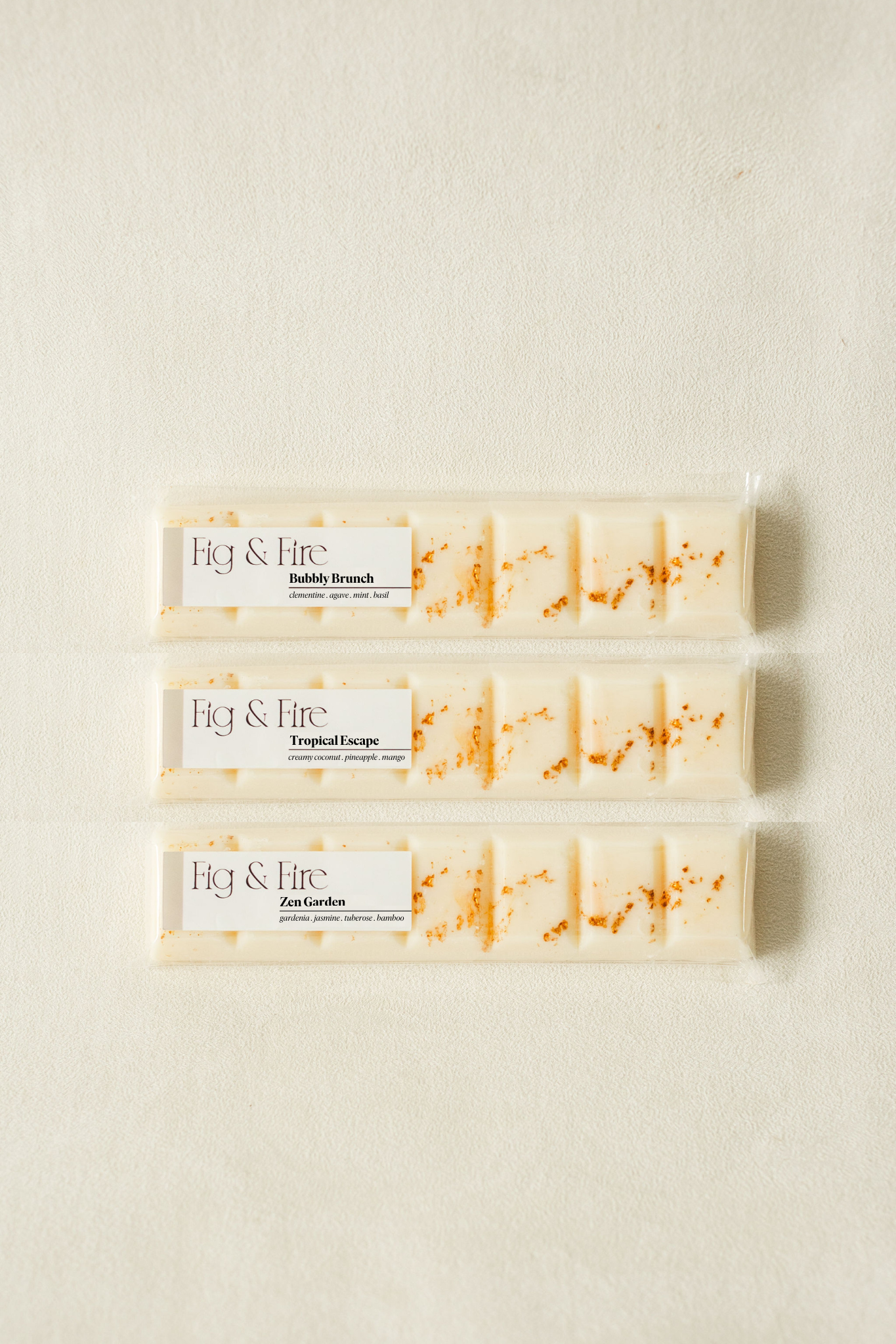 The entire summer collection is featured - Bubbly Brunch, Tropical Escape, and Zen Garden - all-natural, vegan, soy wax melts made with essential oils