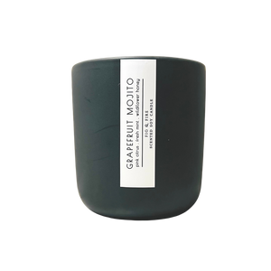Handcrafted candle - scent is Grapefruit Mojito - smells of pink citrus, fresh mint, and wildflower honey - all natural soy candle - vegan, non-toxic, made with essential oils - container is a charcoal ceramic tumbler