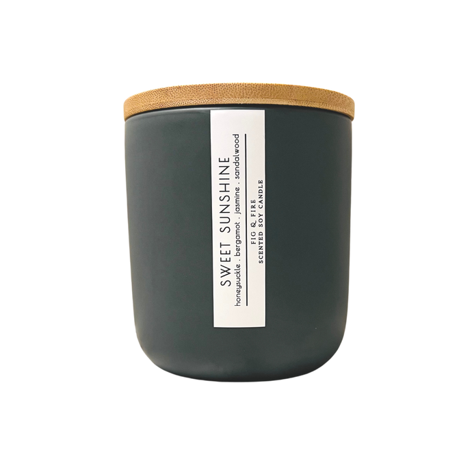 Handcrafted candle - scent is Sweet Sunshine - smells of honeysuckle, bergamot, jasmine, and sandalwood - all natural soy candle - vegan, non-toxic, made with essential oils - container is a charcoal ceramic tumbler with a bamboo wooden lid