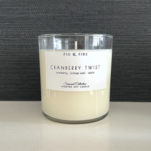 Handcrafted fall candle - scent is Cranberry Twist - smells of cranberry, orange peel, and apple - all natural soy candle - vegan, non-toxic, made with essential oils - container is a clear glass tumbler