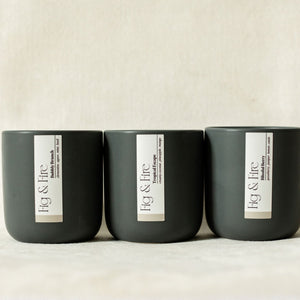The entire summer collection is featured - Blissful Berry, Bubbly Brunch, and Tropical Escape - the vessels are charcoal ceramic tumblers - all-natural, vegan, soy candles made with essential oils