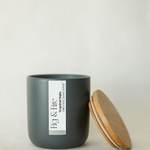 Handcrafted candle - scent is Grapefruit Mojito - scent notes are wildflower honey, pink grapefruit, and fresh mint - all natural soy candle - vegan, non-toxic, made with essential oils - container is a charcoal ceramic tumbler