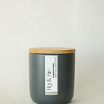 Handcrafted candle - scent is Grapefruit Mojito - scent notes are wildflower honey, pink grapefruit, and fresh mint - all natural soy candle - vegan, non-toxic, made with essential oils - container is a charcoal ceramic tumbler with a bamboo wooden lid