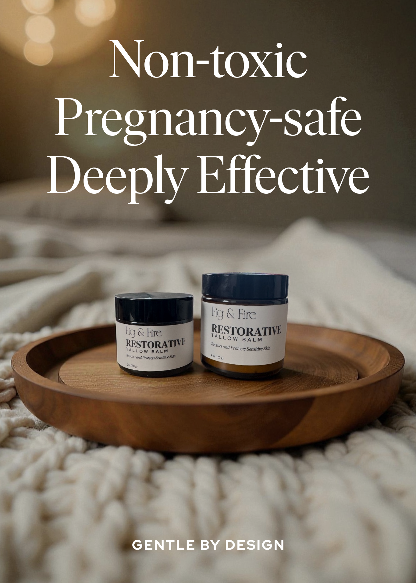 Two jars of Restorative Tallow Balm on a wooden tray on a bed. Tallow Balm is made with organic, grass-fed, and pasture-raised tallow. Baby balm. Suitable for all ages. Text says Non-toxic, pregnancy-safe, deeply effective. Gently by design.