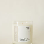 Handcrafted winter candle - scent is winter woods - smells of cypress, fir, evergreen, cedar, and lemon - all natural soy candle - vegan, non-toxic, made with essential oils - seasonal collection - container is a clear glass tumbler