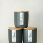 The entire winter collection is featured - Frosted Orchard, Snowy Evening, and Winter Woods - the vessels are charcoal ceramic tumblers with bamboo wooden lids - all-natural, vegan, soy candles made with essential oils