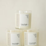 The entire winter collection is featured - Frosted Orchard, Snowy Evening, and Winter Woods - the vessels are clear glass tumblers - all-natural, vegan, soy candles made with essential oils