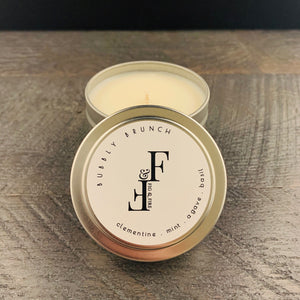 Handcrafted candle - summer seasonal collection - scent is Blissful Berry - smells of clementine, mint, agave, and basil - all natural soy candle - vegan, non-toxic, made with essential oils - container is a silver tin