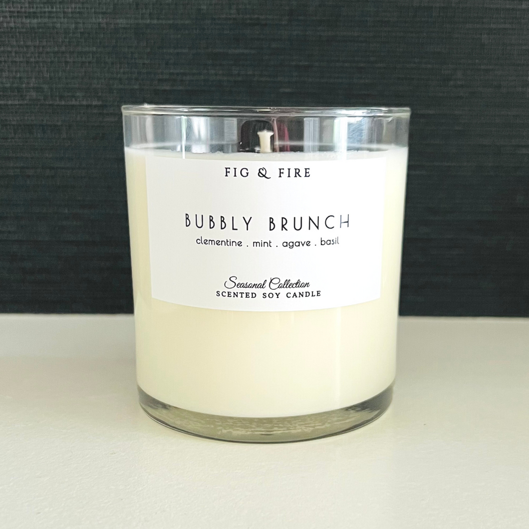 Handcrafted candle - summer seasonal collection - scent is Blissful Berry - smells of clementine, mint, agave, and basil - all natural soy candle - vegan, non-toxic, made with essential oils - container is a clear glass tumbler