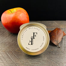 Load image into Gallery viewer, Handcrafted winter candle - scent is frosted orchard - smells of apples, cinnamon, vanilla, maple - all natural soy candle - vegan, non-toxic, made with essential oils, seasonal collection - container is a silver tin