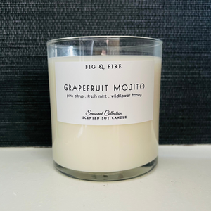 Handcrafted candle - scent is Grapefruit Mojito - smells of pink citrus, fresh mint, and wildflower honey - all natural soy candle - vegan, non-toxic, made with essential oils - container is a clear glass tumbler
