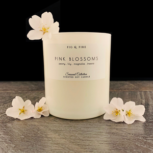 Handcrafted candle - scent is Pink Blossoms - smells of peony, lily, magnolia, and freesia - all natural soy candle - vegan, non-toxic, made with essential oils - container is a white glass tumbler
