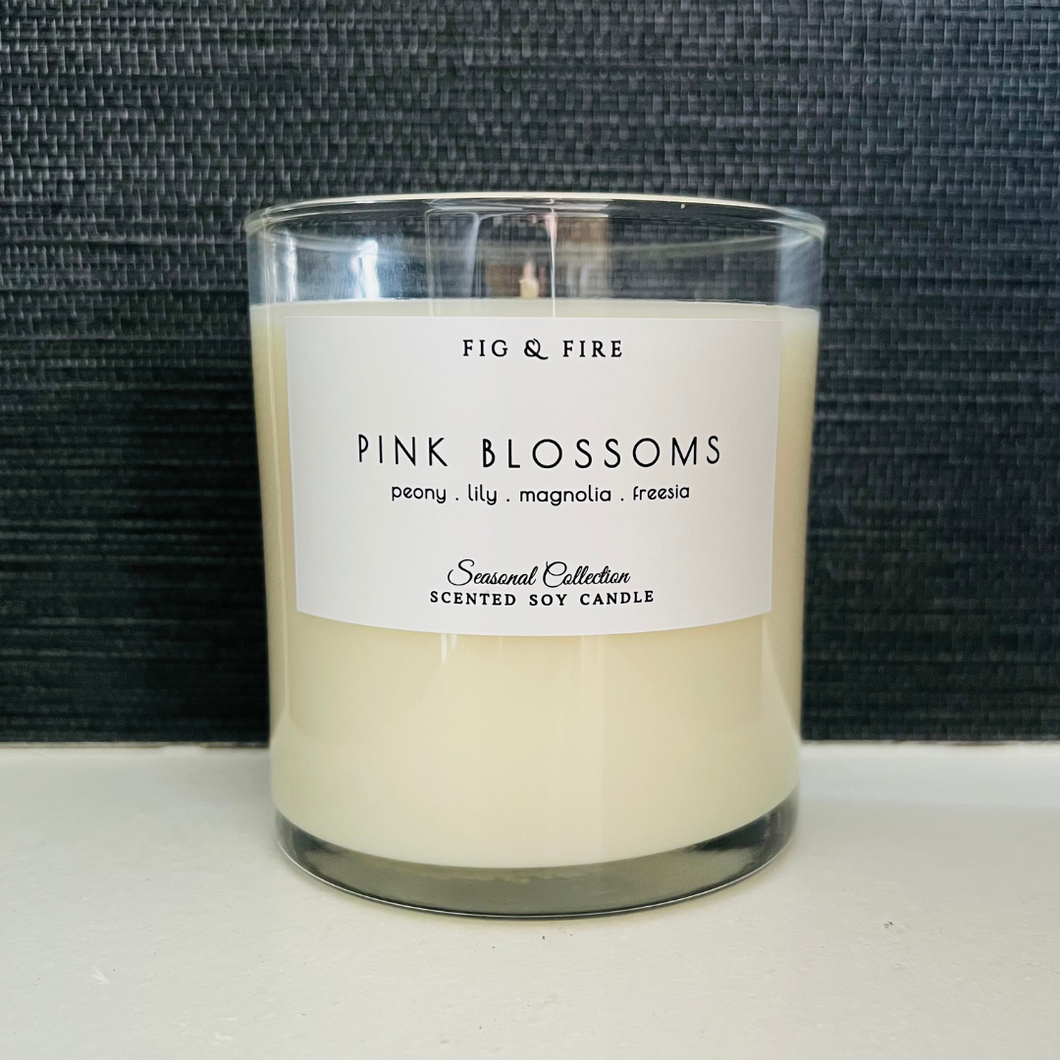 Handcrafted candle - scent is Pink Blossoms - smells of peony, lily, magnolia, and freesia - all natural soy candle - vegan, non-toxic, made with essential oils - container is a clear glass tumbler