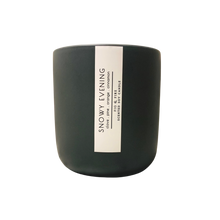 Load image into Gallery viewer, Handcrafted winter candle - scent is snowy evening - smells of clove, pine, orange, and cinnamon - all natural soy candle - vegan, non-toxic, made with essential oils - seasonal collection - container is a charcoal ceramic tumbler