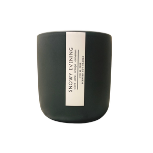 Handcrafted winter candle - scent is snowy evening - smells of clove, pine, orange, and cinnamon - all natural soy candle - vegan, non-toxic, made with essential oils - seasonal collection - container is a charcoal ceramic tumbler
