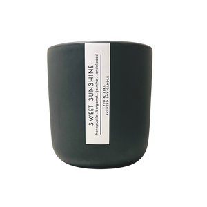 Handcrafted candle - scent is Sweet Sunshine - smells of honeysuckle, bergamot, jasmine, and sandalwood - all natural soy candle - vegan, non-toxic, made with essential oils - container is a charcoal ceramic tumbler