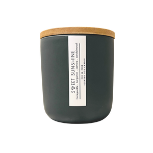 Handcrafted candle - scent is Sweet Sunshine - smells of honeysuckle, bergamot, jasmine, and sandalwood - all natural soy candle - vegan, non-toxic, made with essential oils - container is a charcoal ceramic tumbler with a bamboo wooden lid