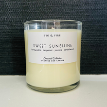 Load image into Gallery viewer, Handcrafted candle - scent is Sweet Sunshine - smells of honeysuckle, bergamot, jasmine, and sandalwood - all natural soy candle - vegan, non-toxic, made with essential oils - container is a clear glass tumbler