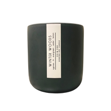 Load image into Gallery viewer, Handcrafted winter candle - scent is winter woods - smells of cypress, fir, evergreen, cedar, and lemon - all natural soy candle - vegan, non-toxic, made with essential oils - seasonal collection - container is a charcoal ceramic tumbler